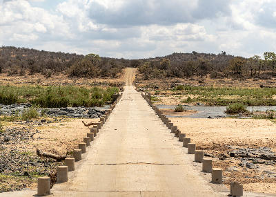 Concrete low-water bridge crossing the Olifants River in Kruger National Park, South Africa.