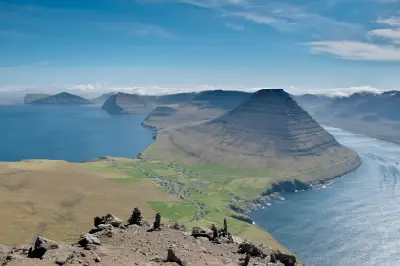 High vantage view from Villingardalsfjall over Viðareiði village and Malinsfjall mountain, with surrounding Norðoyar islands in the Faroe Islands.