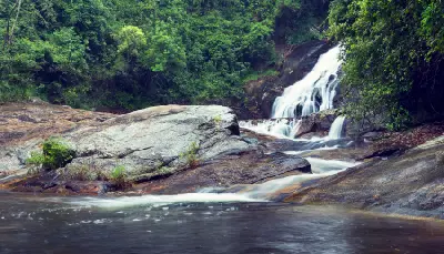 Rock pool and granite slabs below Debengeni Falls in the forests of Magoebaskloof, Limpopo, South Africa.