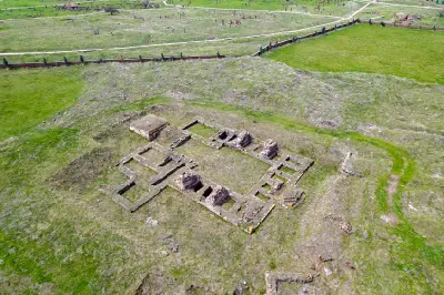 Aerial view of the excavated ruins of Ahlat Ulu Mosque surrounded by the historic Seljuk cemetery and green landscape in eastern Turkey.