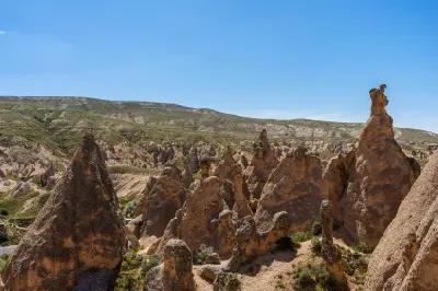 Panoramic view of the eroded volcanic rock formations and imaginative landscape of Devrent Valley in Cappadocia, Turkey.