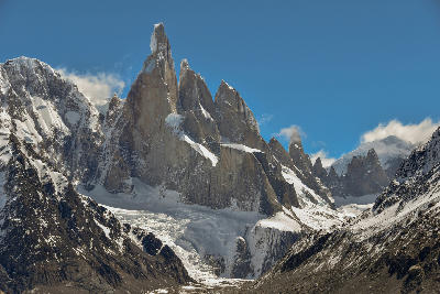 Sharp granite peaks of Cerro Torre and nearby spires above glaciers in Patagonia, Argentina.
