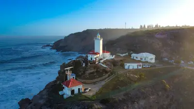 Cape St. Blaize Lighthouse on the cliffs of Mossel Bay at sunset, Garden Route, South Africa