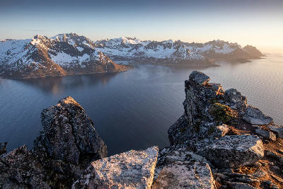 Elevated view across Mefjorden with surrounding alpine peaks on Senja island in Norway