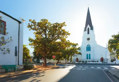 Historic Dutch Reformed Mother Church with tall steeple in Stellenbosch town centre, Cape Winelands, Western Cape, South Africa.