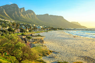 Camps Bay beach along the Atlantic Seaboard, with the Twelve Apostles mountains rising directly above the coastline in Cape Town.