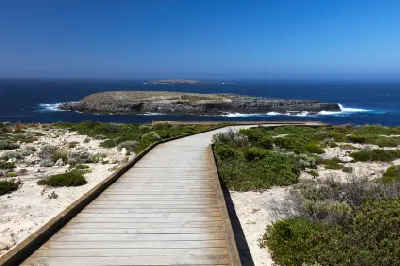 Wooden boardwalk leading towards Admirals Arch with the Casuarina Islets offshore, Kangaroo Island, South Australia.