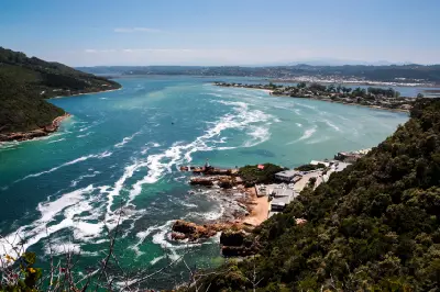 View from Knysna Heads across the entrance channel to the Knysna Lagoon, showing tidal currents, rocky shoreline and estuary landscapes on South Africa's Garden Route.