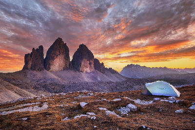 Tre Cime di Lavaredo mountain peaks at sunset in the Dolomites, Italy.