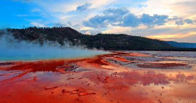 Grand Prismatic Spring sunset Yellowstone Midway Geyser Basin steaming colorful runoff Wyoming USA