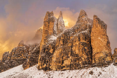 Tre Cime di Lavaredo peaks at sunrise in the Dolomites, Italy.