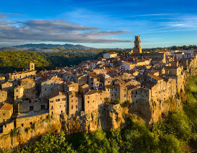 Aerial view of the medieval hilltop town of Pitigliano perched on volcanic cliffs in the Maremma region of Tuscany, Italy.
