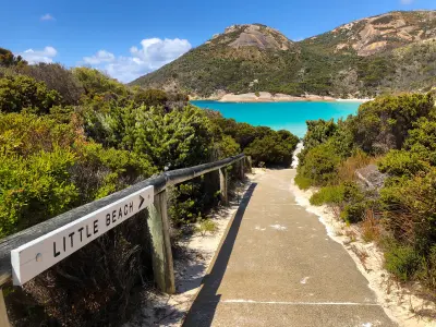 Path and Little Beach sign overlooking turquoise water and Mount Gardner at Two Peoples Bay near Albany, Western Australia.