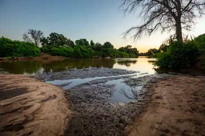 The Luvuvhu River flowing through dense riverine vegetation near Crooks Corner in Kruger National Park.