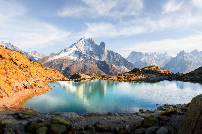 Lac Blanc alpine lake with reflection of Mont Blanc Massif peaks in Chamonix, French Alps.