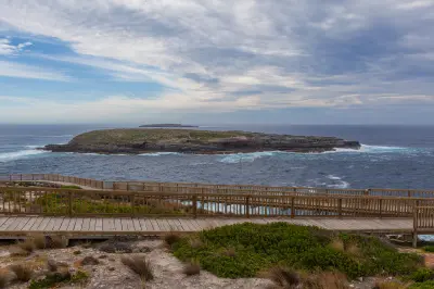 Wooden viewing boardwalk overlooking the Casuarina Islets and Southern Ocean at Cape du Couedic, Kangaroo Island, South Australia.