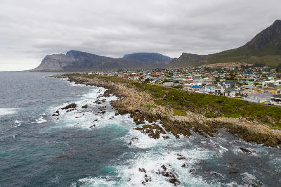 Aerial view of Kleinmond’s rocky coastline beneath the Kogelberg mountains in South Africa