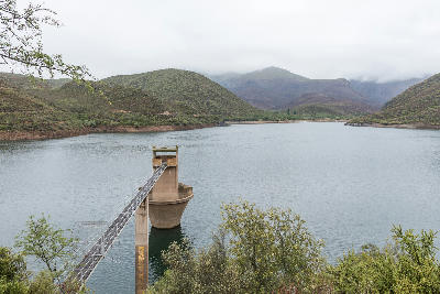 Koos Raubenheimer Dam and water extraction tower surrounded by mountain valleys near Oudtshoorn in the Klein Karoo, Western Cape, South Africa.