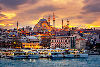 Süleymaniye Mosque overlooking the Bosphorus, with the Galata Bridge and Galata Tower visible across the water in Istanbul, Turkey.