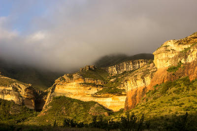 Fog rolling across sandstone cliffs in Golden Gate Highlands National Park, Free State, South Africa.