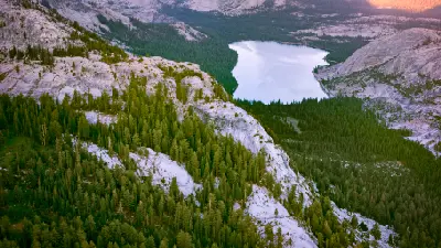 Aerial view of Tenaya Lake with granite domes and forest in Yosemite National Park