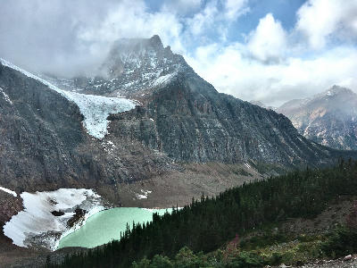 Angel Glacier on Mount Edith Cavell above turquoise Cavell Pond in Jasper National Park