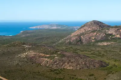 Granite hills, coastal heath and Southern Ocean viewed from Frenchman Peak in Cape Le Grand National Park, Western Australia.