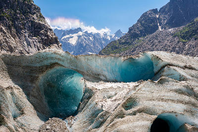 Blue ice crevasses and tunnels on the Mer de Glace glacier in the French Alps.