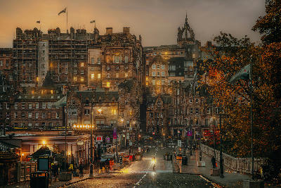 Edinburgh Old Town cityscape from Waverley Bridge with St Giles’ Cathedral and historic buildings at dusk, Edinburgh, Scotland.