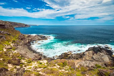 Rocky Kangaroo Island coastline viewed from Fur Seal Lookout, with turquoise surf, coastal cliffs and the Southern Ocean stretching to the horizon.