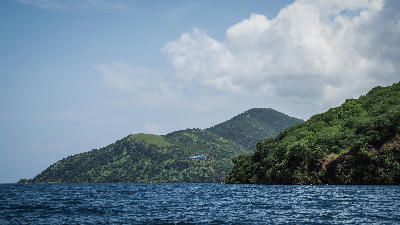 Forested mountains rising directly from the shores of Lake Tanganyika in western Tanzania.