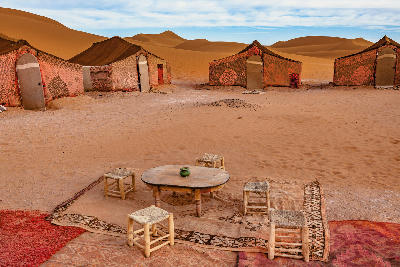 Traditional Berber-style desert camp in the sand dunes near Mhamid and Zagora, Morocco.