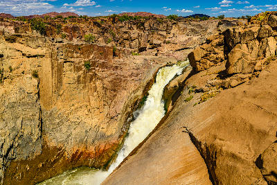 Augrabies Falls cascading into a deep rocky granite canyon in Augrabies Falls National Park, Northern Cape, South Africa.