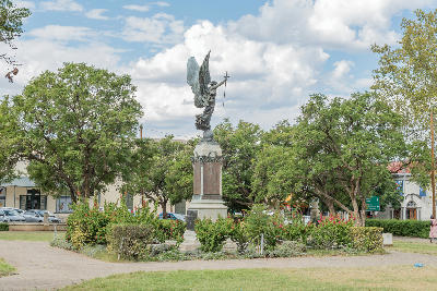 War memorial monument surrounded by gardens and mature trees on Church Square in the historic centre of Graaff-Reinet.
