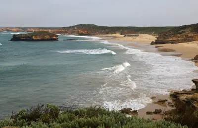 Sandy beach, limestone cliffs and offshore rock formations at Bay of Islands, Victoria.