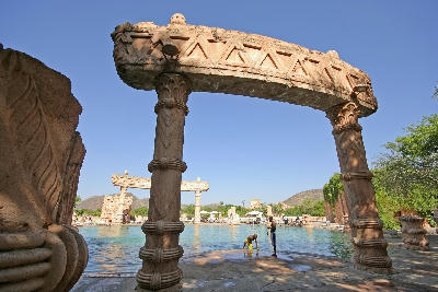 Stone archway and themed swimming pool at The Palace of the Lost City in Sun City, North West Province, South Africa.