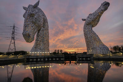 The Kelpies horse head sculptures at sunset beside the Forth and Clyde Canal in Falkirk, Central Scotland.