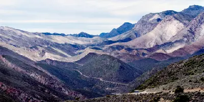 Mountain road winding through the rugged Swartberg Mountains toward Gamkaskloof in the Klein Karoo region of South Africa.