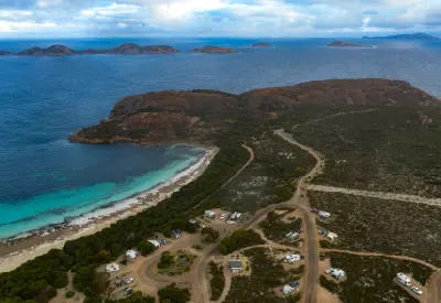 Aerial view of Lucky Bay campground, beach, granite headlands and offshore islands in Cape Le Grand National Park, Western Australia.