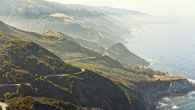 Big Sur coastline with winding Highway 1 and coastal hills in California