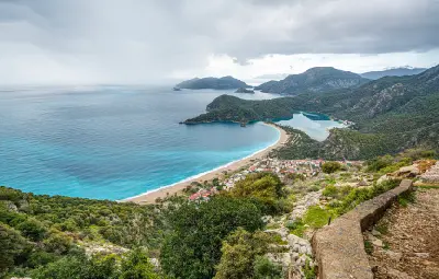 Elevated view of Ölüdeniz and the Blue Lagoon, with Belcekız Beach, forested mountains and the Mediterranean coast near Fethiye, Turkey.