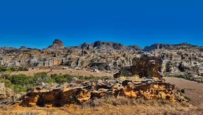 Layered sandstone cliffs and eroded plateau landscapes in Isalo National Park, Madagascar