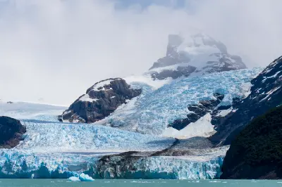 Spegazzini Glacier descending from mountain peaks into a glacial lake in Patagonia, Argentina.