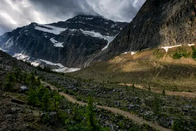 Mount Edith Cavell towering above rocky alpine trail in Jasper National Park