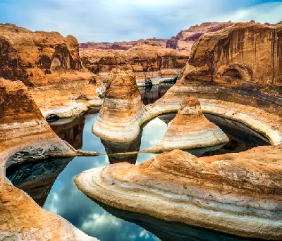 Reflection Canyon Lake Powell sandstone towers curved basin low water levels Glen Canyon Arizona