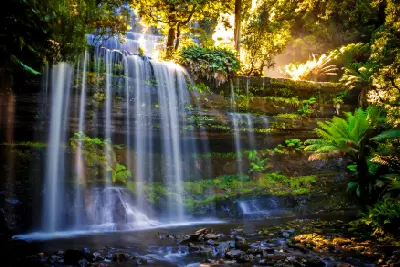 Multi-tiered Russell Falls surrounded by lush temperate rainforest in Mount Field National Park, Tasmania.