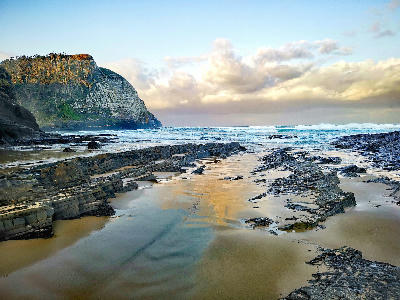 Sandstone cliffs and wave-carved rock platforms along the coastline near Coffee Bay on South Africa's Wild Coast.