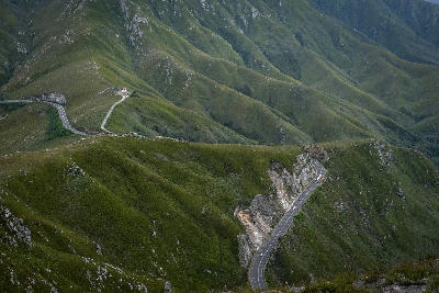 The Outeniqua Pass winds through the rugged green mountains between George and the Little Karoo, forming one of South Africa's most scenic mountain drives.