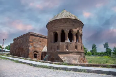 Stone Seljuk mausoleum with an arcaded upper structure at the historic Ahlat cemetery near Lake Van, eastern Turkey.