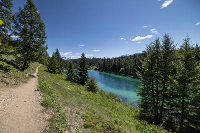 Hiking trail overlooking turquoise lake at Valley of the Five Lakes, Jasper National Park
